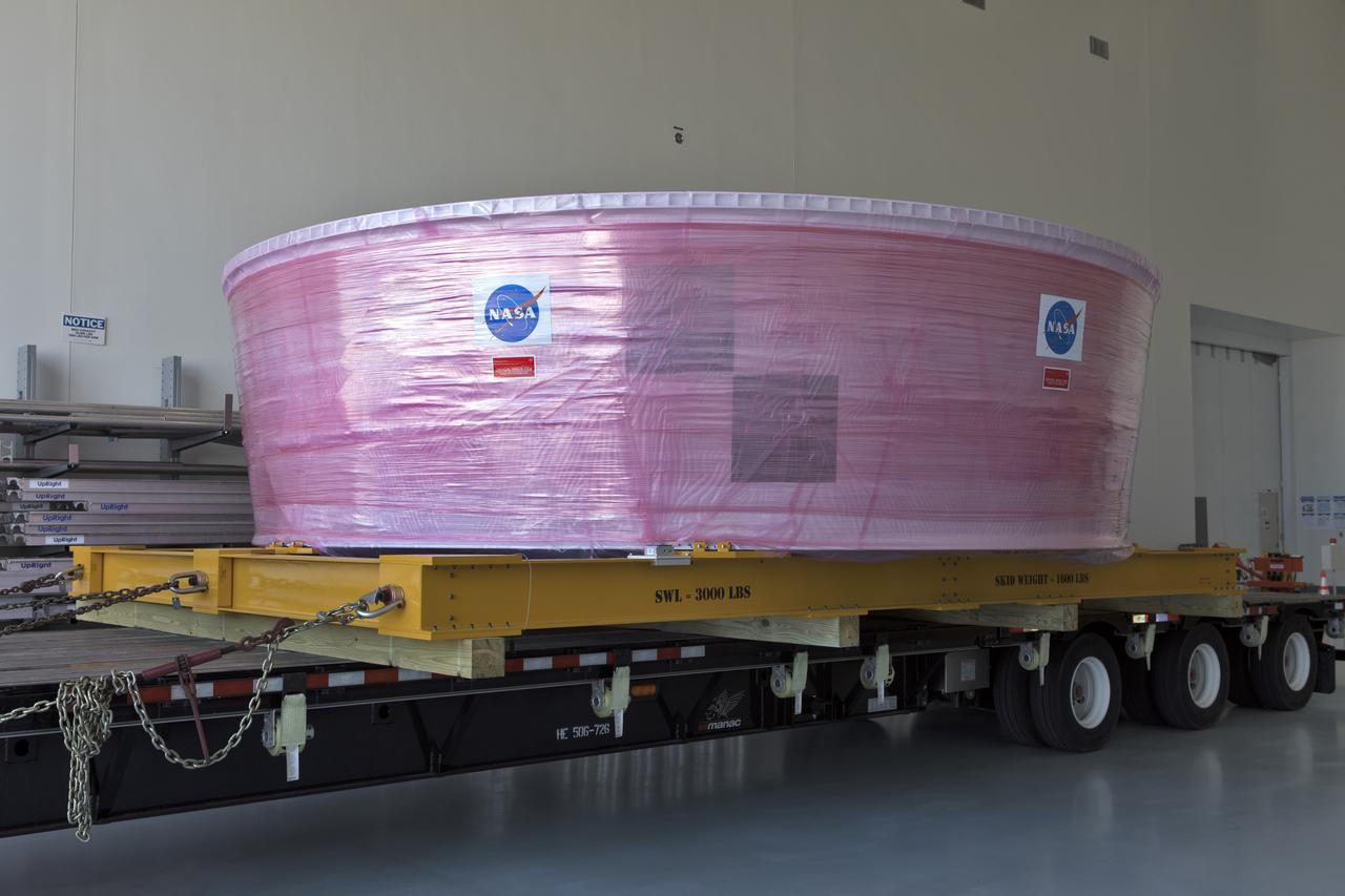 The Orion Stage Adapter (OSA), secured on flatbed transporter, is inside the low bay at the Space Station Processing Facility (SSPF) at NASA's Kennedy Space Center in Florida. The OSA is the second flight-hardware section of the agency's Space Launch System (SLS) rocket to arrive at Kennedy. The OSA will connect the Orion spacecraft to the upper part of the SLS, the interim cryogenic propulsion stage (ICPS). Both the OSA and ICPS are being stored for processing in the SSPF in preparation for Exploration Mission-1, the first uncrewed, integrated launch of the SLS rocket and Orion spacecraft.