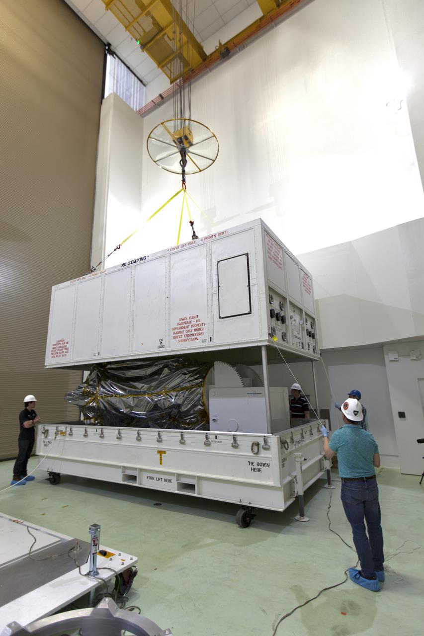 At the Astrotech processing facility in Titusville, Florida, near NASA's Kennedy Space Center, technicians and engineers remove NASA's Parker Solar Probe from its shipping container on Wednesday, April 4, 2018. The Parker Solar Probe will launch on a United Launch Alliance Delta IV Heavy rocket from Space Launch Complex 37 at Cape Canaveral Air Force Station in Florida no earlier than Aug. 4, 2018. The mission will perform the closest-ever observations of a star when it travels through the Sun's atmosphere, called the corona. The probe will rely on measurements and imaging to revolutionize our understanding of the corona and the Sun-Earth connection.