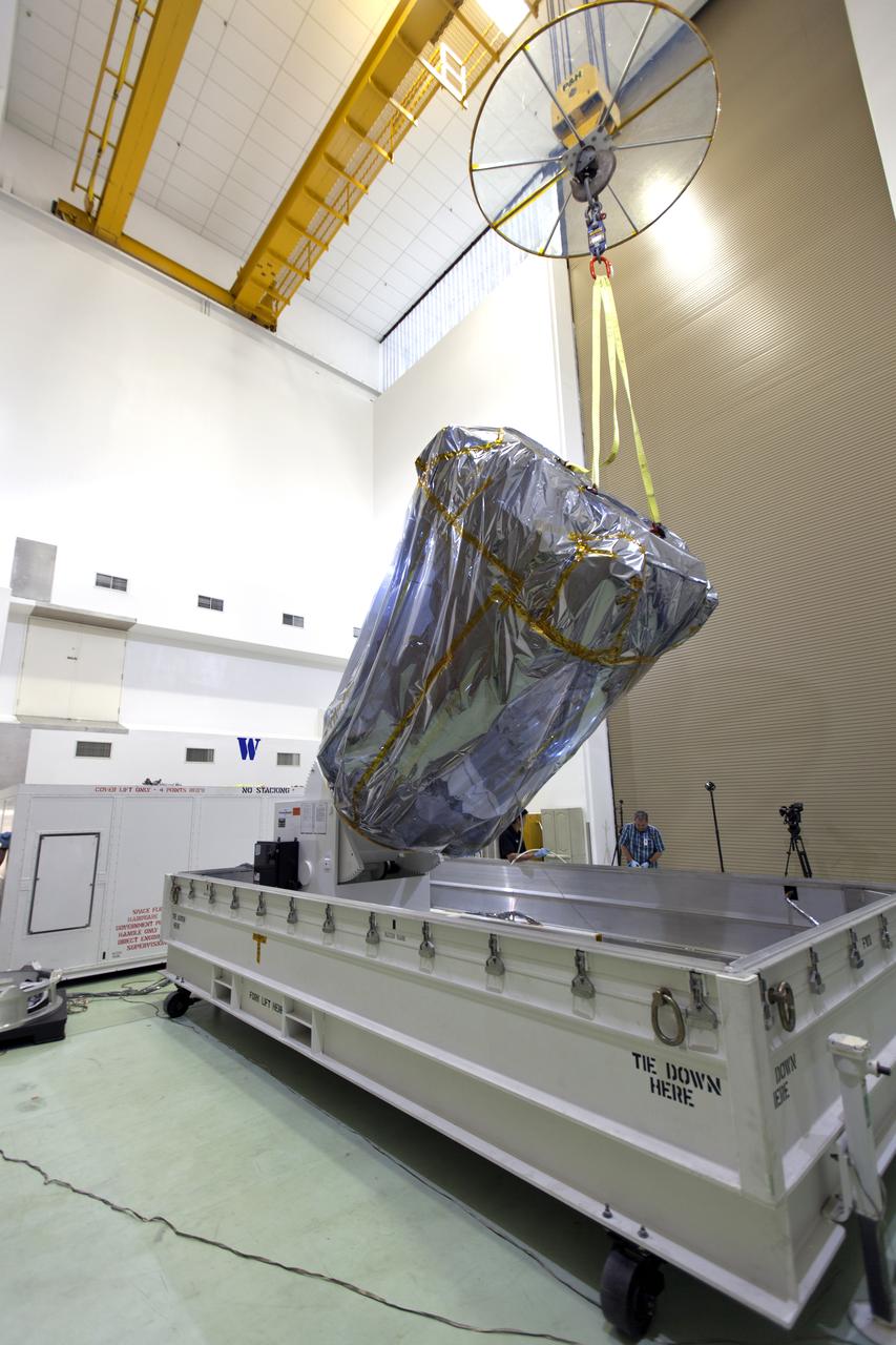 At the Astrotech processing facility in Titusville, Florida, near NASA's Kennedy Space Center, NASA's Parker Solar Probe is removed from its shipping container on Wednesday, April 4, 2018. The Parker Solar Probe will launch on a United Launch Alliance Delta IV Heavy rocket from Space Launch Complex 37 at Cape Canaveral Air Force Station in Florida no earlier than Aug. 4, 2018. The mission will perform the closest-ever observations of a star when it travels through the Sun's atmosphere, called the corona. The probe will rely on measurements and imaging to revolutionize our understanding of the corona and the Sun-Earth connection.