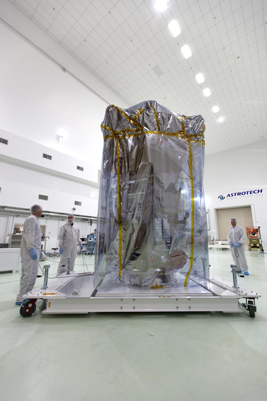 At the Astrotech processing facility in Titusville, Florida, near NASA's Kennedy Space Center, technicians and engineers remove NASA's Parker Solar Probe from its shipping bag on Wednesday, April 4, 2018. The Parker Solar Probe will launch on a United Launch Alliance Delta IV Heavy rocket from Space Launch Complex 37 at Cape Canaveral Air Force Station in Florida no earlier than Aug. 4, 2018. The mission will perform the closest-ever observations of a star when it travels through the Sun's atmosphere, called the corona. The probe will rely on measurements and imaging to revolutionize our understanding of the corona and the Sun-Earth connection.
