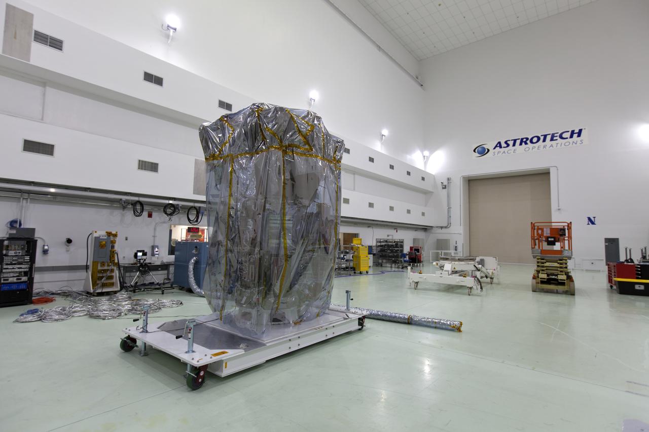 At the Astrotech processing facility in Titusville, Florida, near NASA's Kennedy Space Center, NASA's Parker Solar Probe is removed from its shipping bag on Wednesday, April 4, 2018. The Parker Solar Probe will launch on a United Launch Alliance Delta IV Heavy rocket from Space Launch Complex 37 at Cape Canaveral Air Force Station in Florida no earlier than Aug. 4, 2018. The mission will perform the closest-ever observations of a star when it travels through the Sun's atmosphere, called the corona. The probe will rely on measurements and imaging to revolutionize our understanding of the corona and the Sun-Earth connection.