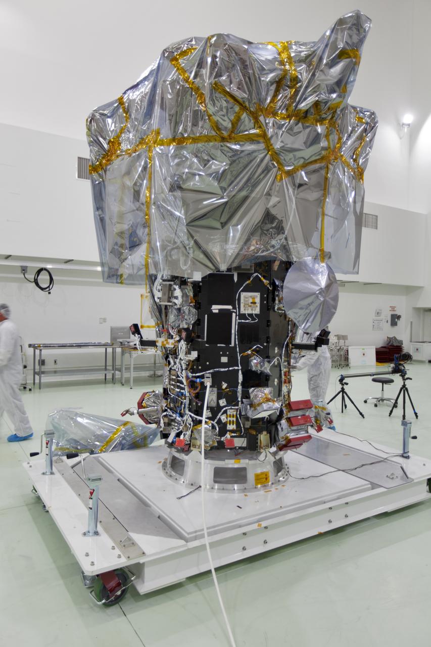 At the Astrotech processing facility in Titusville, Florida, near NASA's Kennedy Space Center, NASA's Parker Solar Probe is removed from its shipping bag on Wednesday, April 4, 2018. The Parker Solar Probe will launch on a United Launch Alliance Delta IV Heavy rocket from Space Launch Complex 37 at Cape Canaveral Air Force Station in Florida no earlier than Aug. 4, 2018. The mission will perform the closest-ever observations of a star when it travels through the Sun's atmosphere, called the corona. The probe will rely on measurements and imaging to revolutionize our understanding of the corona and the Sun-Earth connection.