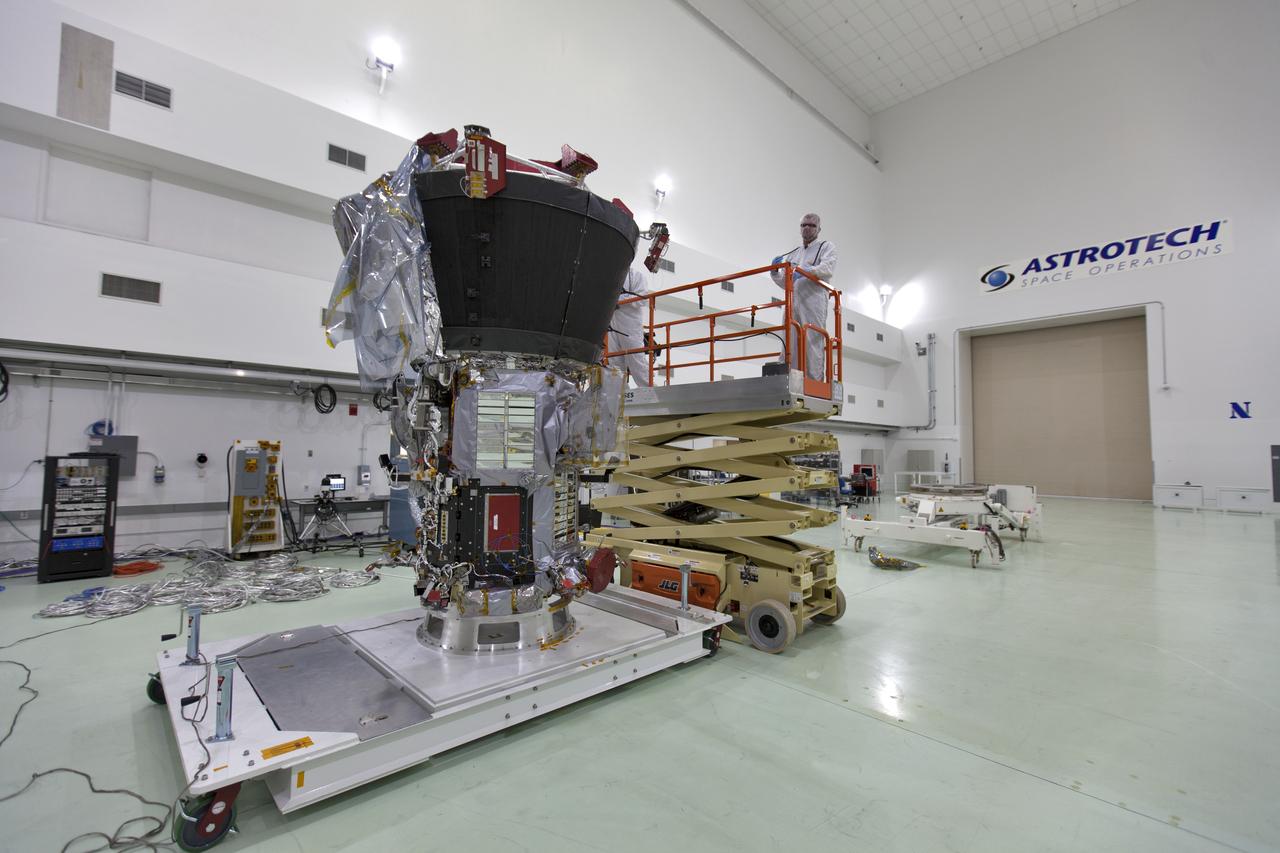 At the Astrotech processing facility in Titusville, Florida, near NASA's Kennedy Space Center, technicians and engineers remove NASA's Parker Solar Probe from its shipping bag on Wednesday, April 4, 2018. The Parker Solar Probe will launch on a United Launch Alliance Delta IV Heavy rocket from Space Launch Complex 37 at Cape Canaveral Air Force Station in Florida no earlier than Aug. 4, 2018. The mission will perform the closest-ever observations of a star when it travels through the Sun's atmosphere, called the corona. The probe will rely on measurements and imaging to revolutionize our understanding of the corona and the Sun-Earth connection.