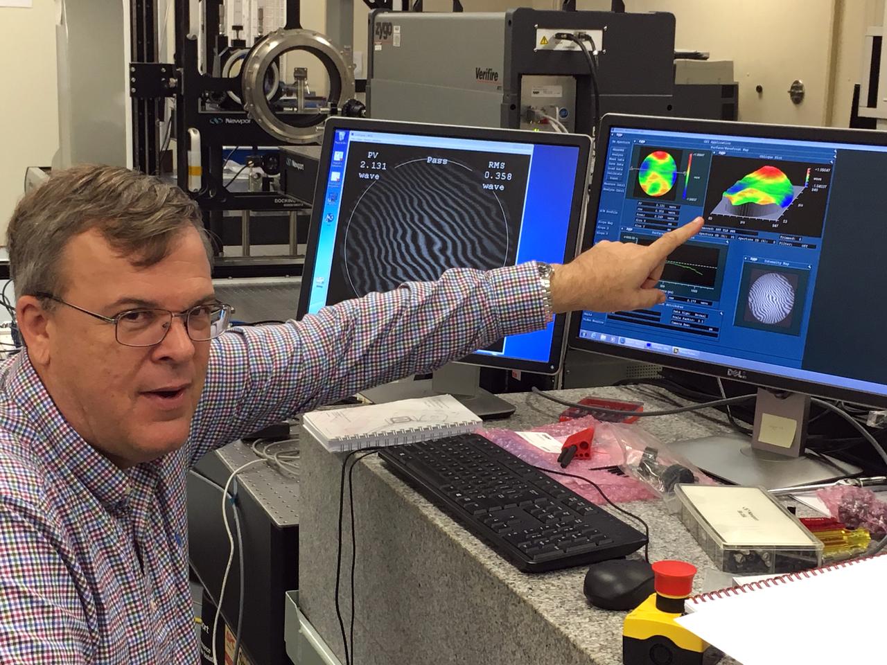 Mark Nurge, Ph.D., a physicist in the Applied Physics Lab with the Exploration Research and Technology Programs at NASA's Kennedy Space Center in Florida, looks at data during the first optical quality test on a full window stack that is ready for installation in the docking hatch of NASA's Orion spacecraft. The data from the tests will help improve the requirements for manufacturing tolerances on Orion's windows and verify how the window should perform in space. Orion is being prepared for its first integrated uncrewed flight atop NASA's Space Launch System rocket on Exploration Mission-1.