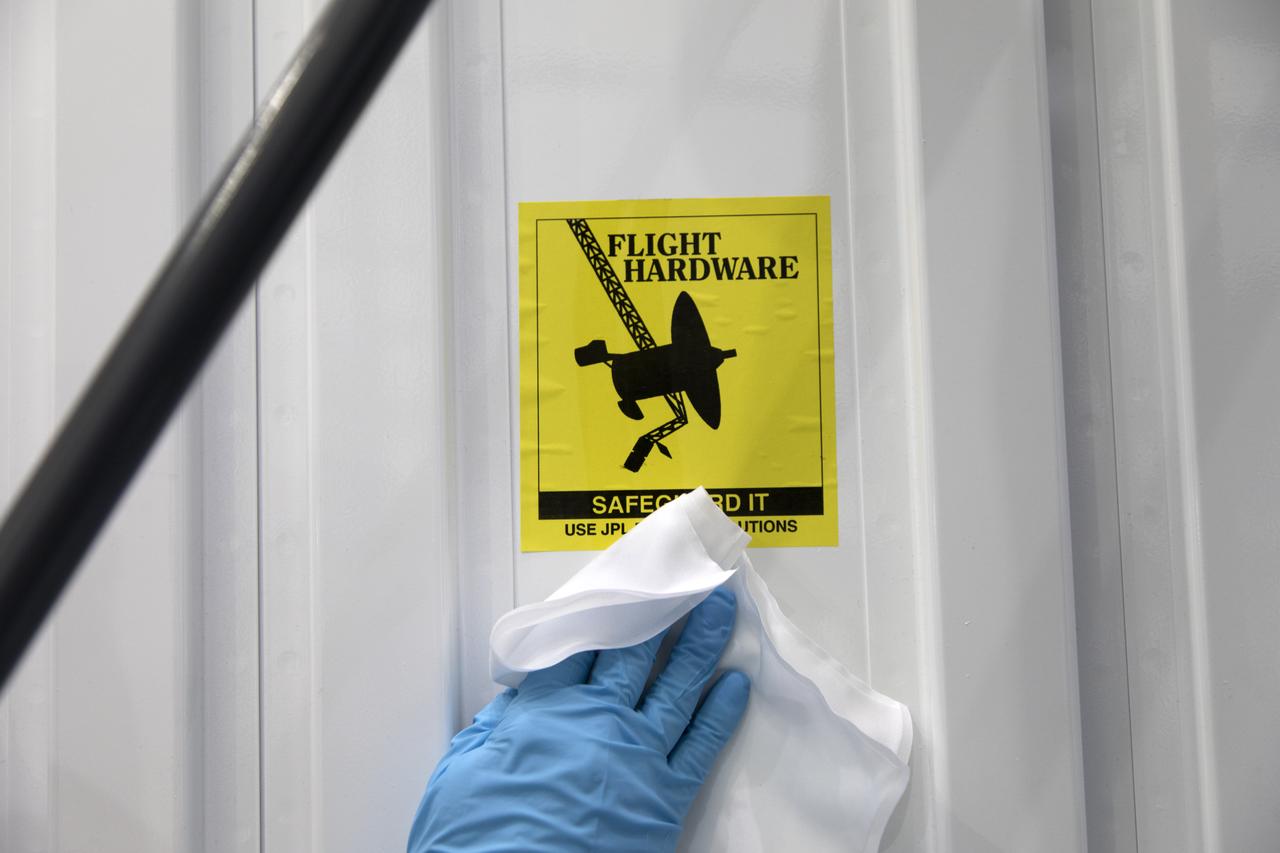 In the Space Station Processing Facility at NASA's Kennedy Space Center in Florida, the ECOsystem Spaceborne Thermal Radiometer Experiment on Space Station (ECOSTRESS) has arrived in its shipping container. The container is being inspected and thoroughly cleaned prior to opening. ECOSTRESS is designed to monitor one of the most basic processes in living plants: the loss of water through the tiny pores in leaves. ECOSTRESS will launch to the International Space Station aboard a Dragon spacecraft launched by a Falcon 9 rocket on the SpaceX CRS-15 mission in June 2018.