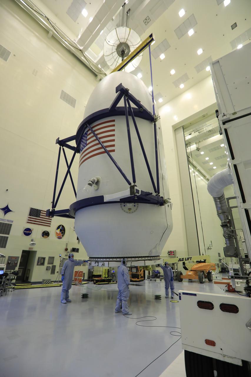 Inside the Payload Hazardous Servicing Facility at NASA's Kennedy Space Center in Florida, technicians assist as the SpaceX payload fairing containing the agency's Transiting Exoplanet Survey Satellite (TESS) is lifted for the move to a transporter. The fairing will be moved to Space Launch Complex 40 at Cape Canaveral Air Force Station. The satellite is scheduled to launch atop the SpaceX Falcon 9 rocket at 6:32 p.m. EDT on April 16. TESS is the next step in NASA's search for planets outside our solar system, known as exoplanets. TESS is a NASA Astrophysics Explorer mission led and operated by MIT in Cambridge, Massachusetts, and managed by NASA’s Goddard Space Flight Center in Greenbelt, Maryland. Dr. George Ricker of MIT’s Kavli Institute for Astrophysics and Space Research serves as principal investigator for the mission. Additional partners include Orbital ATK, NASA’s Ames Research Center, the Harvard-Smithsonian Center for Astrophysics and the Space Telescope Science Institute. More than a dozen universities, research institutes and observatories worldwide are participants in the mission. NASA’s Launch Services Program is responsible for launch management. 