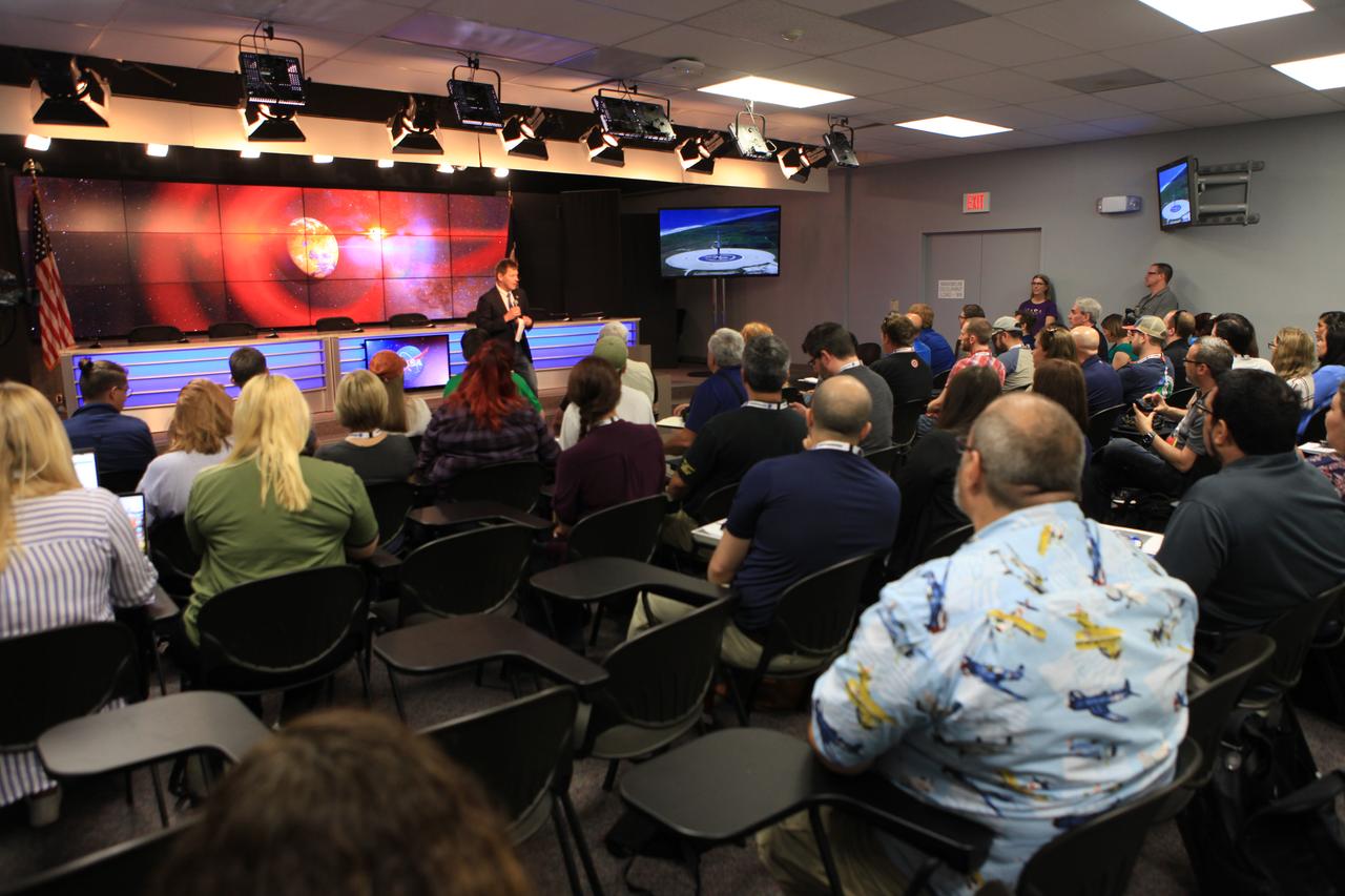 NASA and industry leaders speak to NASA Social participants about the agency's Transiting Exoplanet Survey Satellite (TESS) in the Press Site auditorium at Kennedy Space Center in Florida. Speaking to the group is Hans Koenigsmann, vice president of Build and Flight Reliability at SpaceX. TESS is the next step in the search for planets outside of our solar system. The mission will find exoplanets that periodically block part of the light from their host stars, events called transits. The satellite will survey the nearest and brightest stars for two years to search for transiting exoplanets. TESS will launch on a SpaceX Falcon 9 rocket from Space Launch Complex 40 at Cape Canaveral Air Force Station no earlier than 6:32 p.m. EDT on Monday, April 16. 