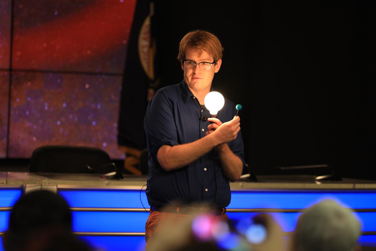 NASA and industry leaders speak to NASA Social participants about the agency's Transiting Exoplanet Survey Satellite (TESS) in the Press Site auditorium at Kennedy Space Center in Florida. Speaking to the group is Zach Berta-Thompson, assistant professor, University of Colorado Boulder. TESS is the next step in the search for planets outside of our solar system. The mission will find exoplanets that periodically block part of the light from their host stars, events called transits. The satellite will survey the nearest and brightest stars for two years to search for transiting exoplanets. TESS will launch on a SpaceX Falcon 9 rocket from Space Launch Complex 40 at Cape Canaveral Air Force Station no earlier than 6:32 p.m. EDT on Monday, April 16.