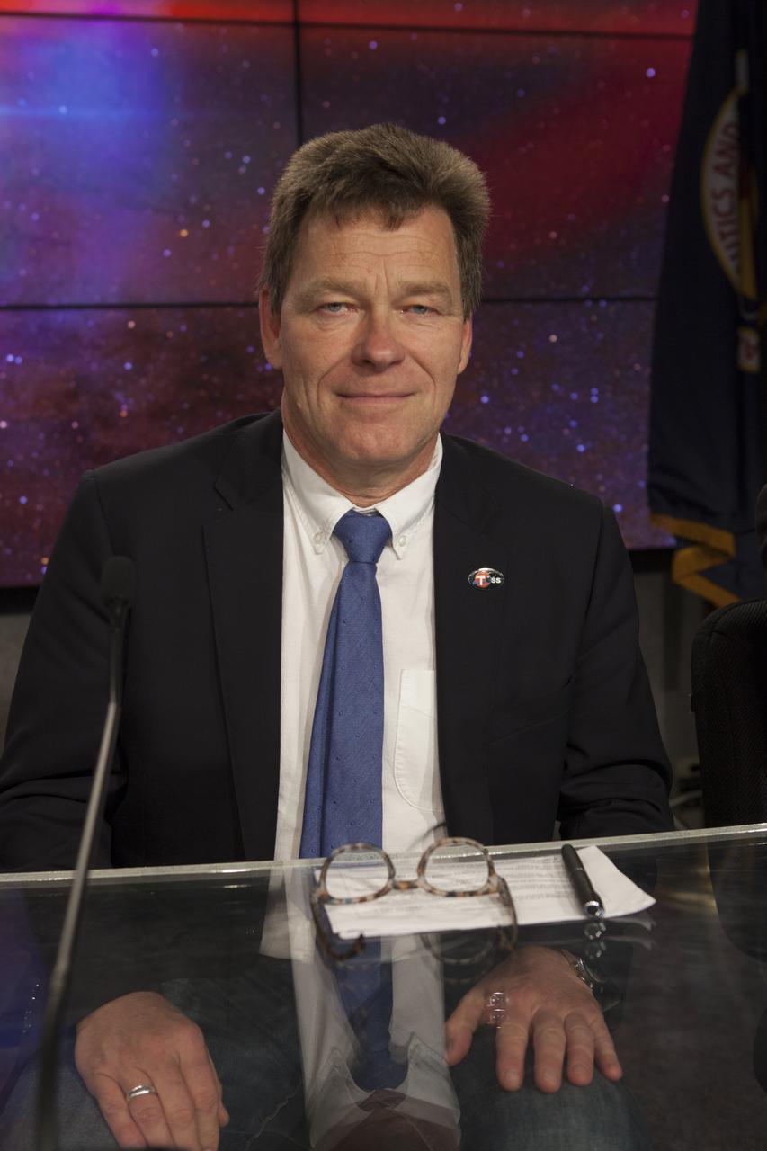 In Kennedy Space Center's Press Site auditorium, members of the media participate in a mission briefing on NASA's Transiting Exoplanet Survey Satellite (TESS). Hans Koenigsmann, vice president of Build and Flight Reliability at SpaceX, answers questions during the briefing. TESS is the next step in the search for planets outside of our solar system. The mission will find exoplanets that periodically block part of the light from their host stars, events called transits. The satellite will survey the nearest and brightest stars for two years to search for transiting exoplanets. TESS will launch on a SpaceX Falcon 9 rocket from Space Launch Complex 40 at Cape Canaveral Air Force Station no earlier than 6:32 p.m. EDT on Monday, April 16. 