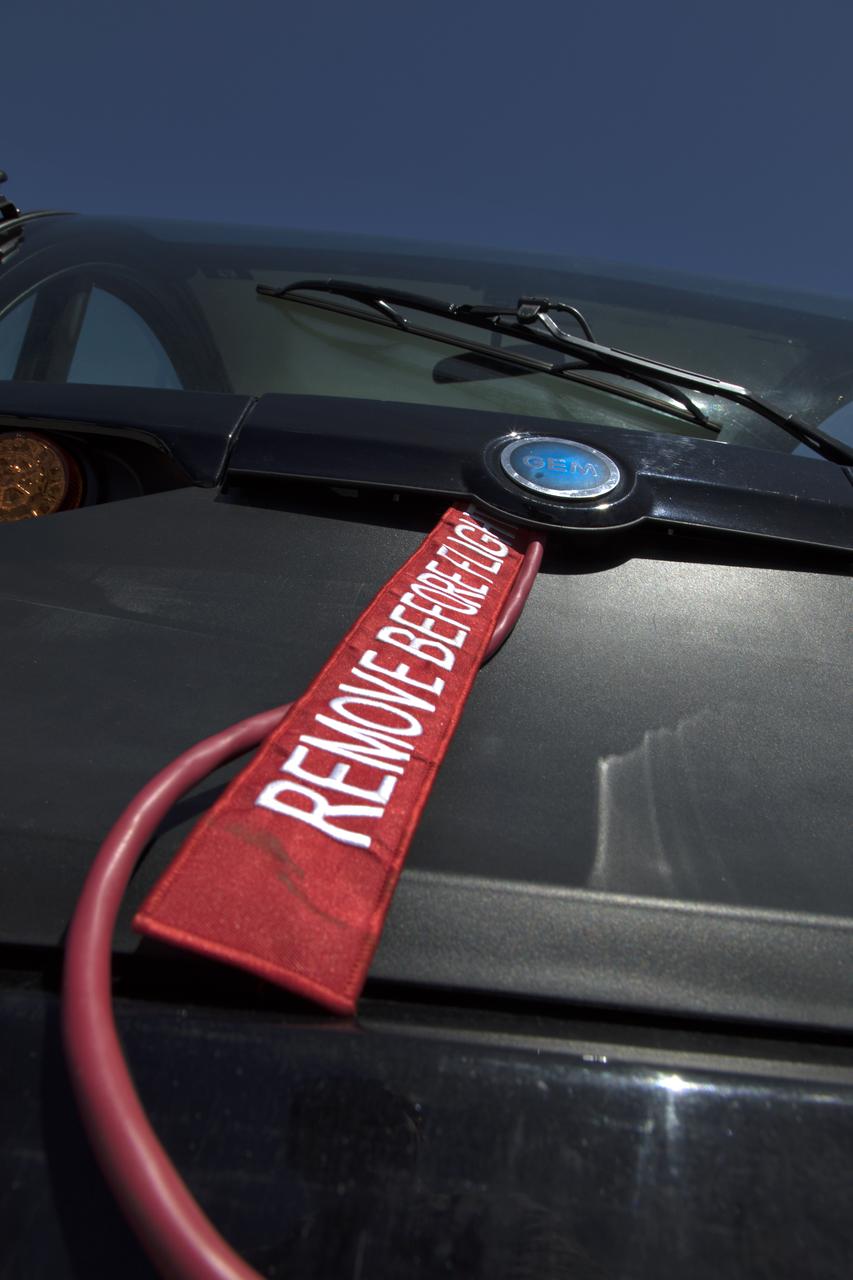 During the annual Earth Day celebration at the Kennedy Space Center Visitor Complex, guests have an opportunity to get an up-close look at experimental electric vehicles. The "Remove Before Flight" tag is on a Polaris GEM electric car. The two-day event featured approximately 50 exhibitors offering information on a variety of topics, including electric vehicles, sustainable lighting, renewable energy, Florida-friendly landscaping tips, Florida’s biking trails and more.