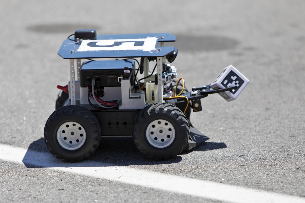 In the Swarmathon competition at the Kennedy Space Center Visitor Complex, students were asked to develop computer code for the small robots, programming them to look for "resources" in the form of AprilTag cubes, similar to barcodes. Teams developed search algorithms for the Swarmies to operate autonomously, communicating and interacting as a collective swarm similar to ants foraging for food. In the spaceport's third annual Swarmathon, 23 teams represented 24 minority serving universities and community colleges were invited to develop software code to operate these innovative robots known as "Swarmies" to help find resources when astronauts explore distant locations, such as the Moon or Mars.