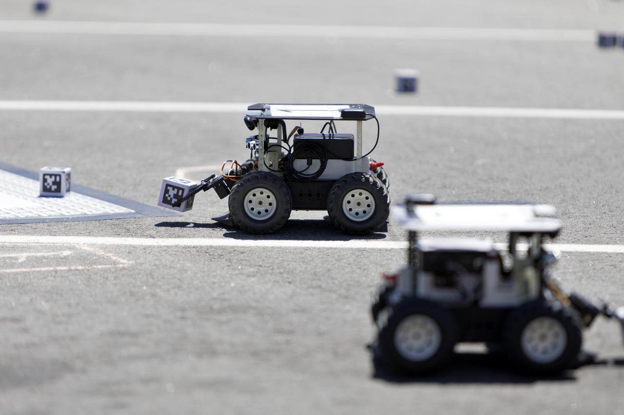 In the Swarmathon competition at the Kennedy Space Center Visitor Complex, students were asked to develop computer code for the small robots, programming them to look for "resources" in the form of AprilTag cubes, similar to barcodes. Teams developed search algorithms for the Swarmies to operate autonomously, communicating and interacting as a collective swarm similar to ants foraging for food. In the spaceport's third annual Swarmathon, 23 teams represented 24 minority serving universities and community colleges were invited to develop software code to operate these innovative robots known as "Swarmies" to help find resources when astronauts explore distant locations, such as the Moon or Mars.