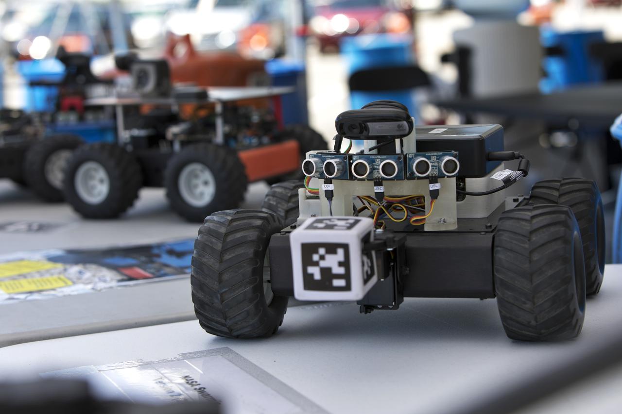 In the Swarmathon competition at the Kennedy Space Center Visitor Complex, students were asked to develop computer code for the small robots, programming them to look for "resources" in the form of AprilTag cubes, similar to barcodes. Teams developed search algorithms for the Swarmies to operate autonomously, communicating and interacting as a collective swarm similar to ants foraging for food. In the spaceport's third annual Swarmathon, 23 teams represented 24 minority serving universities and community colleges were invited to develop software code to operate these innovative robots known as "Swarmies" to help find resources when astronauts explore distant locations, such as the Moon or Mars.