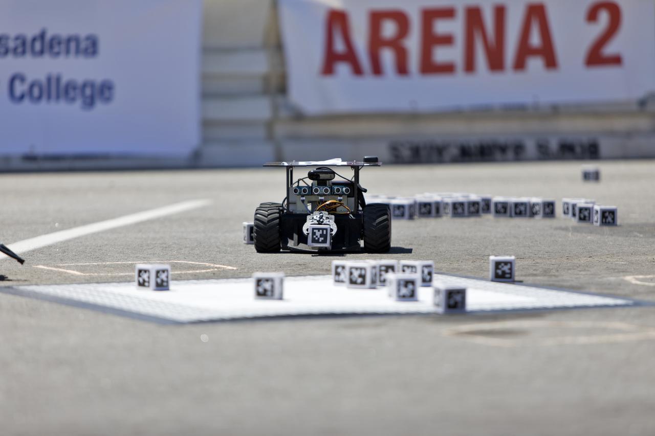 In the Swarmathon competition at the Kennedy Space Center Visitor Complex, students were asked to develop computer code for the small robots, programming them to look for "resources" in the form of AprilTag cubes, similar to barcodes. Teams developed search algorithms for the Swarmies to operate autonomously, communicating and interacting as a collective swarm similar to ants foraging for food. In the spaceport's third annual Swarmathon, 23 teams represented 24 minority serving universities and community colleges were invited to develop software code to operate these innovative robots known as "Swarmies" to help find resources when astronauts explore distant locations, such as the Moon or Mars.