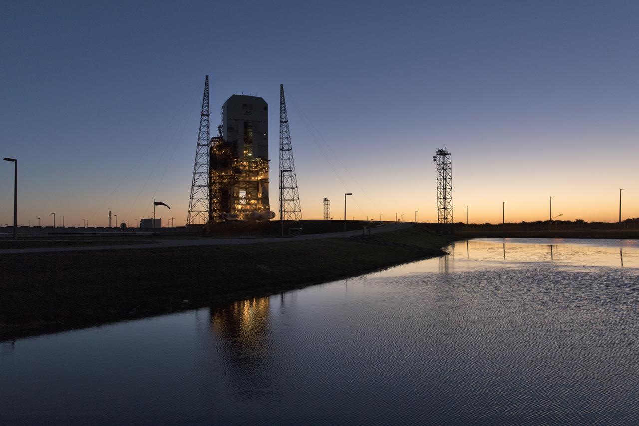 In this sunrise photograph, the first stage of a United Launch Alliance Delta IV Heavy rocket is at the Vertical Integration Facility near Space Launch Complex 37 at Cape Canaveral Air Force Station in Florida. The Delta IV Heavy will launch NASA's upcoming Parker Solar Probe mission in July 2018. The mission will perform the closest-ever observations of a star when it travels through the Sun's atmosphere, called the corona. The probe will rely on measurements and imaging to revolutionize our understanding of the corona and the Sun-Earth connection. 