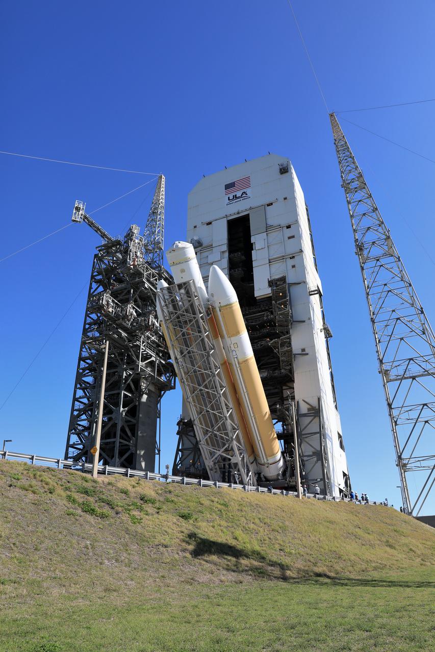 A brilliant blue sky serves as a backdrop as the United Launch Alliance Delta IV Heavy first stage is being lifted to the vertical position at the Vertical Integration Facility near Space Launch 37 at Cape Canaveral Air Force Station in Florida. The Delta IV Heavy will launch NASA's upcoming Parker Solar Probe mission in July 2018. The mission will perform the closest-ever observations of a star when it travels through the Sun's atmosphere, called the corona. The probe will rely on measurements and imaging to revolutionize our understanding of the corona and the Sun-Earth connection. 