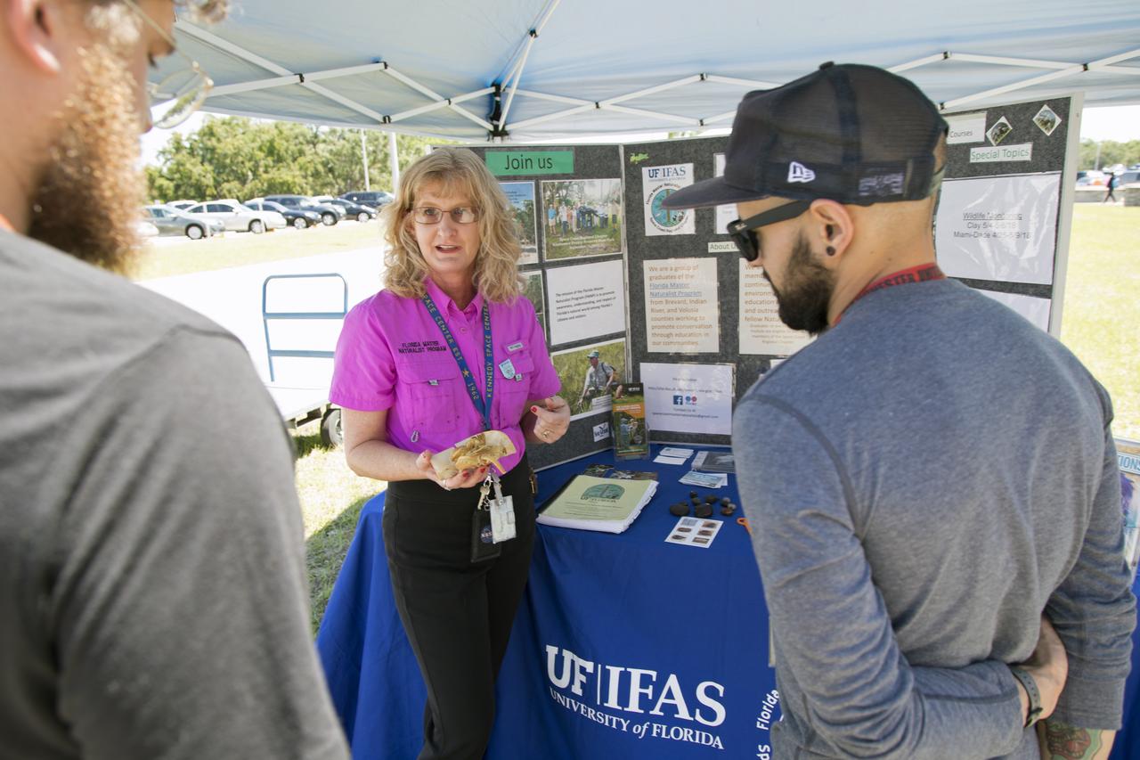 Employees get an up-close look at some Florida marine life during a visit to the University of Florida's Institute of Food and Agricultural Sciences booth at Kennedy Space Center’s annual Earth Day celebration. The two-day event featured approximately 50 exhibitors offering information on a variety of topics, including electric vehicles, sustainable lighting, renewable energy, Florida-friendly landscaping tips, Florida’s biking trails and more.