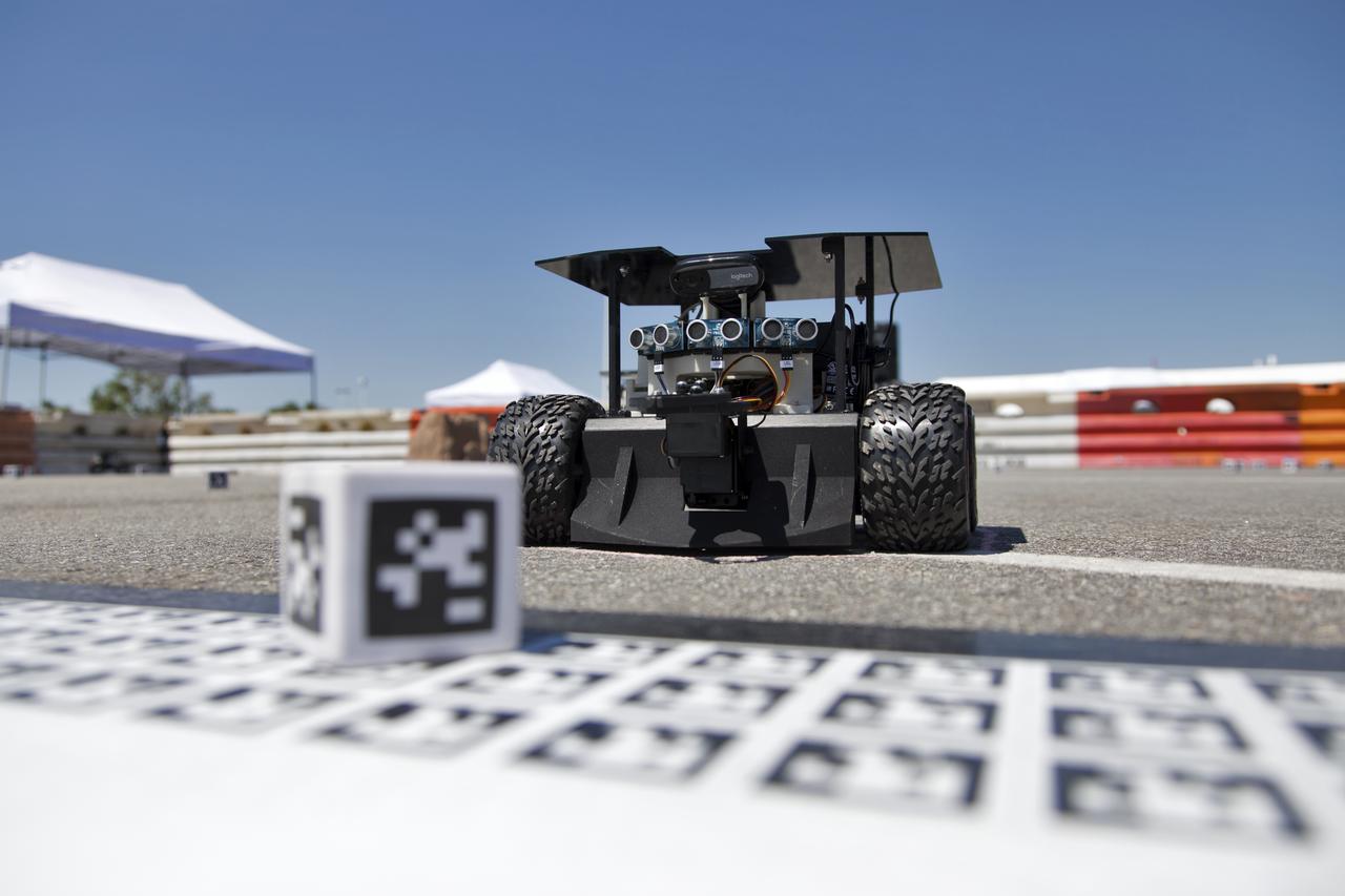In the Swarmathon competition at the Kennedy Space Center Visitor Complex, students were asked to develop computer code for the small robots, programming them to look for "resources" in the form of AprilTag cubes, similar to barcodes. Teams developed search algorithms for the Swarmies to operate autonomously, communicating and interacting as a collective swarm similar to ants foraging for food. In the spaceport's third annual Swarmathon, 23 teams represented 24 minority serving universities and community colleges were invited to develop software code to operate these innovative robots known as "Swarmies" to help find resources when astronauts explore distant locations, such as the Moon or Mars.