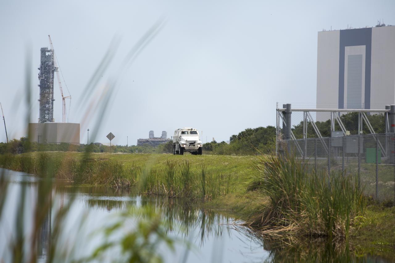An MRAP armored vehicle goes through a training run on the Shuttle Landing Facility to support NASA's Commercial Crew Program at the agency's Kennedy Space Center in Florida. The 45,000-pound mine-resistant. The MRAP offers a mobile bunker for astronauts and ground crews in the unlikely event they have to get away from the launch pad quickly in an emergency.