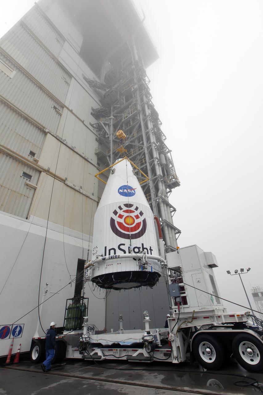 At Space Launch Complex 3 at Vandenberg Air Force Base in California, a crane is used to lift NASA's Interior Exploration using Seismic Investigations, Geodesy and Heat Transport, or InSight, Mars lander for mating atop a United Launch Alliance Atlas V rocket. InSight will be the first mission to look deep beneath the Martian surface. It will study the planet's interior by measuring its heat output and listen for marsquakes. The spacecraft will use the seismic waves generated by marsquakes to develop a map of the planet’s deep interior. The resulting insight into Mars’ formation will provide a better understanding of how other rocky planets, including Earth, were created. InSight is scheduled for liftoff May 5, 2018.