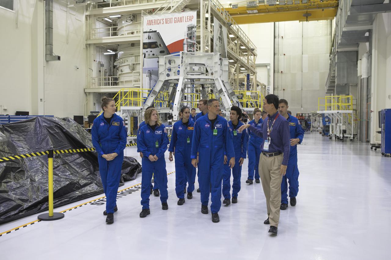 The 2017 class of astronaut candidates are inside the Neil Armstrong Operations and Checkout Building high bay during a familiarization tour of facilities at NASA's Kennedy Space Center in Florida. The candidates toured center facilities, including the Launch Control Center, Launch Pad 39B, the Vehicle Assembly Building and the Space Station Processing Facility. They also toured Boeing's Commercial Crew and Cargo Facility, United Launch Alliance's Space Launch Complex 41 at Cape Canaveral Air Force Station, and SpaceX's Launch Pad 39A at Kennedy. The candidates will spend about two years getting to know the space station systems and learning how to spacewalk, speak Russian, control the International Space Station's robotic arm and fly T-38s, before they're eligible to be assigned to a mission.