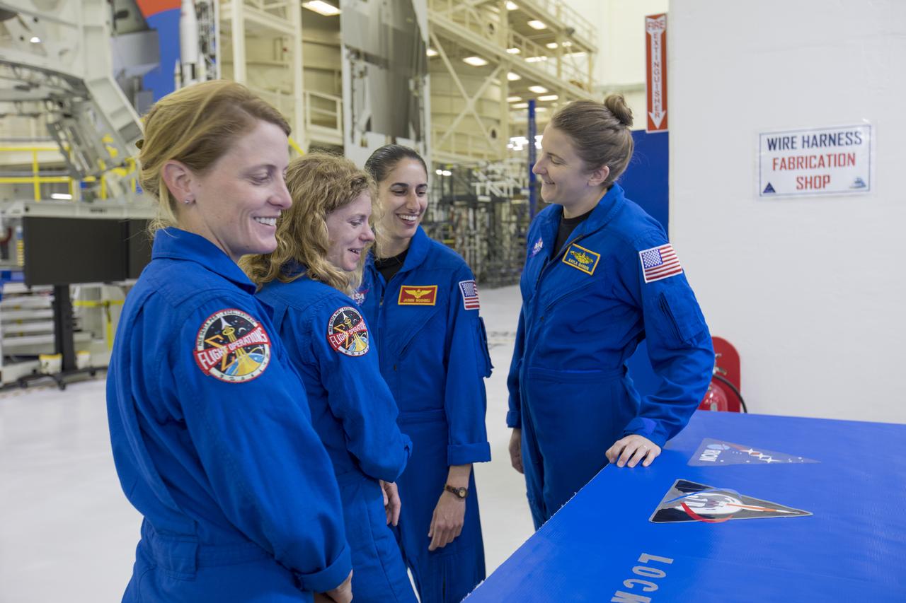 Members of the 2017 class of astronaut candidates are inside the Neil Armstrong Operations and Checkout Building high bay during a familiarization tour of facilities at NASA's Kennedy Space Center in Florida. The candidates toured center facilities, including the Vehicle Assembly Building, Launch Control Center, Launch Pad 39B and the Space Station Processing Facility. They also toured Boeing's Commercial Crew and Cargo Facility, and United Launch Alliance's Space Launch Complex 41 at Cape Canaveral Air Force Station. The candidates will spend about two years getting to know the space station systems and learning how to spacewalk, speak Russian, control the International Space Station's robotic arm and fly T-38s, before they're eligible to be assigned to a mission.