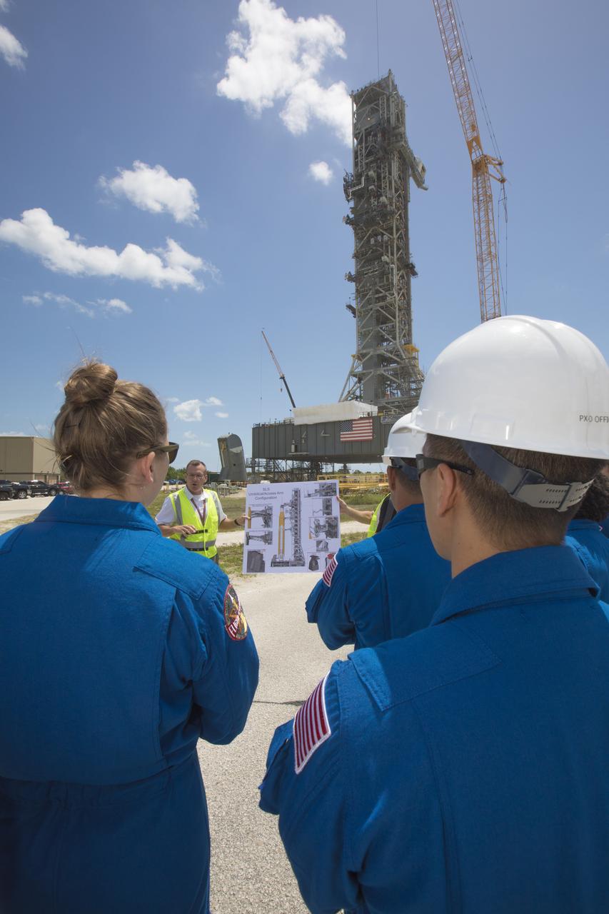 The 2017 class of astronaut candidates view the mobile launcher during a familiarization tour at NASA's Kennedy Space Center in Florida. The candidates toured center facilities, including the Neil Armstrong Operations and Checkout Building high bay; the Launch Control Center, Launch Pad 39B, and the Vehicle Assembly Building. They also toured Boeing's Commercial Crew and Cargo Facility, United Launch Alliance's Space Launch Complex 41 at Cape Canaveral Air Force Station, and SpaceX's Launch Pad 39A at Kennedy. The candidates will spend about two years getting to know the space station systems and learning how to spacewalk, speak Russian, control the International Space Station's robotic arm and fly T-38s, before they're eligible to be assigned to a mission.