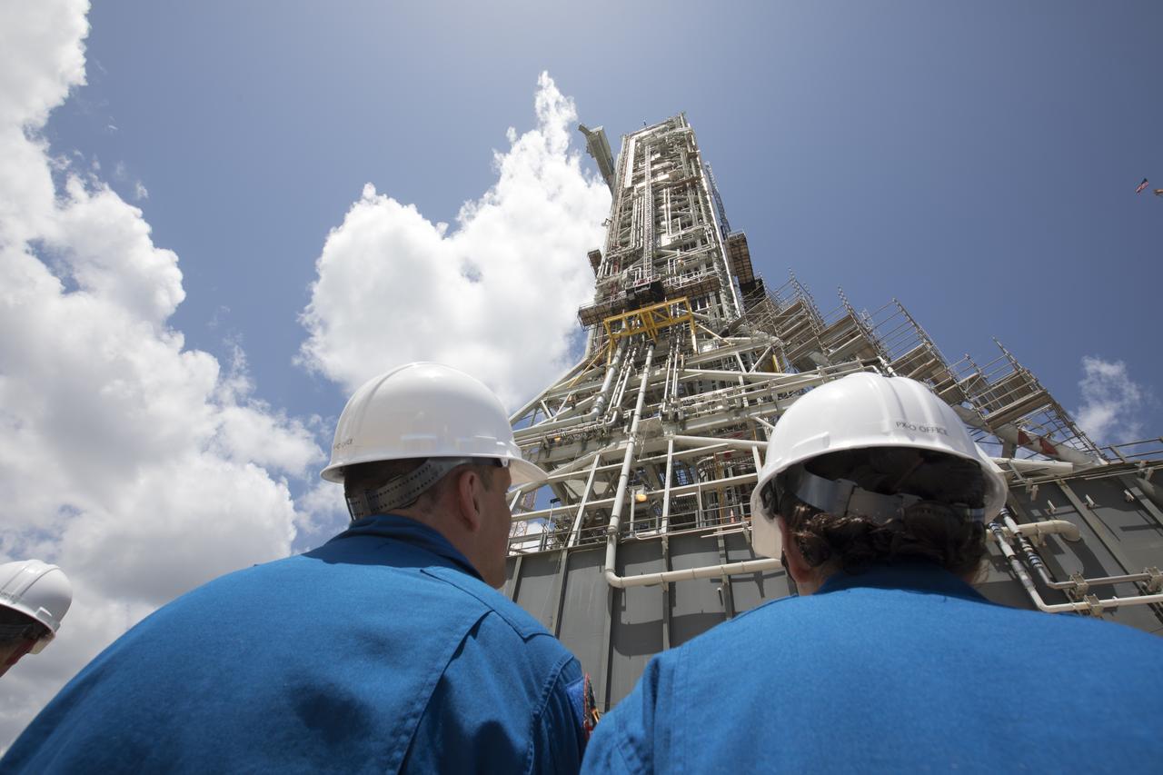 The 2017 class of astronaut candidates get a close-up view of the mobile launcher during a familiarization tour at NASA's Kennedy Space Center in Florida. The candidates toured center facilities, including the Neil Armstrong Operations and Checkout Building high bay; the Launch Control Center, Launch Pad 39B, and the Vehicle Assembly Building. They also toured Boeing's Commercial Crew and Cargo Facility, United Launch Alliance's Space Launch Complex 41 at Cape Canaveral Air Force Station, and SpaceX's Launch Pad 39A at Kennedy. The candidates will spend about two years getting to know the space station systems and learning how to spacewalk, speak Russian, control the International Space Station's robotic arm and fly T-38s, before they're eligible to be assigned to a mission.