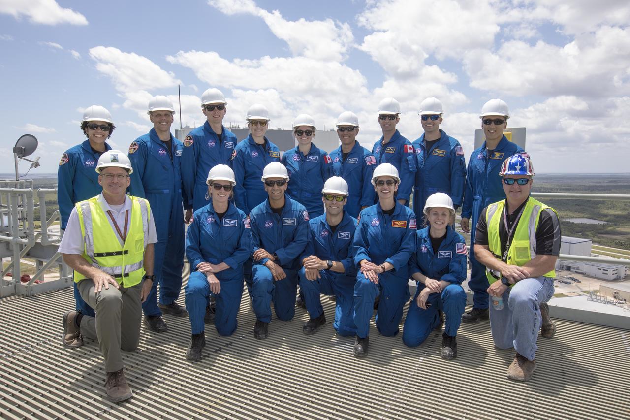 The 2017 class of astronaut candidates pause for a group photograph on the deck of the mobile launcher during a familiarization tour at NASA's Kennedy Space Center in Florida. The candidates toured center facilities, including the Neil Armstrong Operations and Checkout Building high bay; the Launch Control Center, Launch Pad 39B and the Vehicle Assembly Building. They also toured Boeing's Commercial Crew and Cargo Facility, United Launch Alliance's Space Launch Complex 41 at Cape Canaveral Air Force Station, and SpaceX's Launch Pad 39A at Kennedy. The candidates will spend about two years getting to know the space station systems and learning how to spacewalk, speak Russian, control the International Space Station's robotic arm and fly T-38s, before they're eligible to be assigned to a mission.