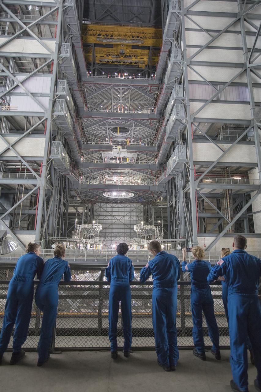 The 2017 class of astronaut candidates view the new work platforms in High Bay 3 of the Vehicle Assembly Building during a familiarization tour at NASA's Kennedy Space Center in Florida. The candidates toured center facilities, including the Neil Armstrong Operations and Checkout Building high bay; Launch Control Center, Launch Pad 39B, and the Space Station Processing Facility. They also toured Boeing's Commercial Crew and Cargo Facility, United Launch Alliance's Space Launch Complex 41 at Cape Canaveral Air Force Station, and Space Launch Complex 39A at Kennedy. The candidates will spend about two years getting to know the space station systems and learning how to spacewalk, speak Russian, control the International Space Station's robotic arm and fly T-38s, before they're eligible to be assigned to a mission.