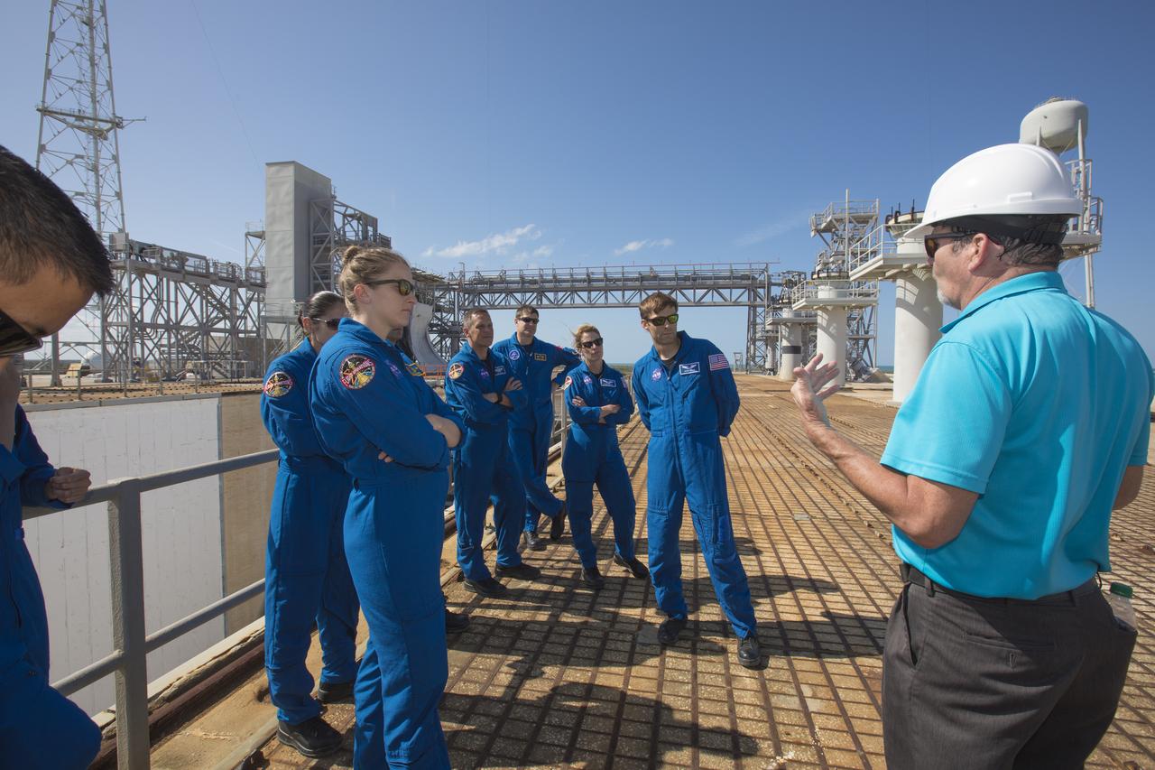 Members of the 2017 class of astronaut candidates are on the surface of Launch Pad 39B during a familiarization tour of facilities at NASA's Kennedy Space Center in Florida. The candidates toured center facilities, including the Vehicle Assembly Building, Launch Control Center, Neil Armstrong Operations and Checkout Building high bay and the Space Station Processing Facility. They also toured Boeing's Commercial Crew and Cargo Facility, United Launch Alliance's Space Launch Complex 41 at Cape Canaveral Air Force Station, and SpaceX's Launch Pad 39A at Kennedy. The candidates will spend about two years getting to know the space station systems and learning how to spacewalk, speak Russian, control the International Space Station's robotic arm and fly T-38s, before they're eligible to be assigned to a mission.