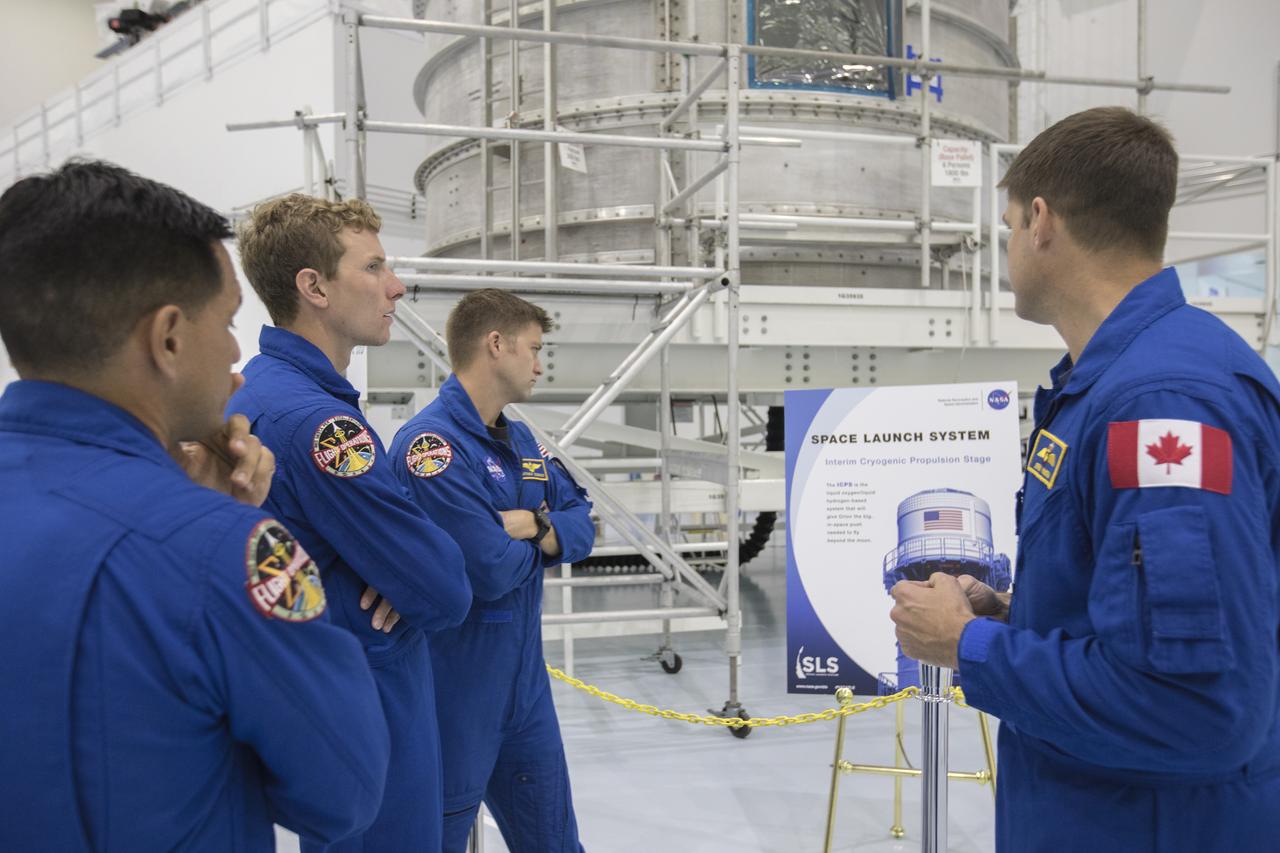 The 2017 class of astronaut candidates are inside the Space Station Processing Facility high bay during a familiarization tour of facilities at NASA's Kennedy Space Center in Florida. They are viewing the Interim Cryogenic Propulsion System for NASA's Space Launch System rocket. The candidates toured center facilities, including the Neil Armstrong Operations and Checkout Building high bay; the Launch Control Center, Launch Pad 39B, and the Vehicle Assembly Building. They also toured Boeing's Commercial Crew and Cargo Facility, United Launch Alliance's Space Launch Complex 41 at Cape Canaveral Air Force Station, and SpaceX's Launch Pad 39A at Kennedy. The candidates will spend about two years getting to know the space station systems and learning how to spacewalk, speak Russian, control the International Space Station's robotic arm and fly T-38s, before they're eligible to be assigned to a mission.