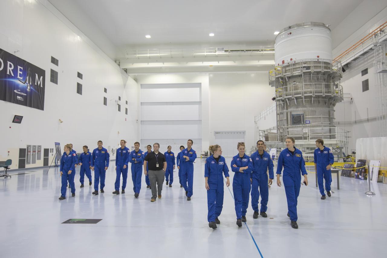 The 2017 class of astronaut candidates are inside the Space Station Processing Facility high bay during a familiarization tour of facilities at NASA's Kennedy Space Center in Florida. Behind them is the Interim Cryogenic Propulsion System for NASA's Space Launch System rocket. The candidates toured center facilities, including the Neil Armstrong Operations and Checkout Building high bay; the Launch Control Center, Launch Pad 39B, and the Vehicle Assembly Building. They also toured Boeing's Commercial Crew and Cargo Facility, United Launch Alliance's Space Launch Complex 41 at Cape Canaveral Air Force Station, and SpaceX's Launch Pad 39A at Kennedy. The candidates will spend about two years getting to know the space station systems and learning how to spacewalk, speak Russian, control the International Space Station's robotic arm and fly T-38s, before they're eligible to be assigned to a mission.