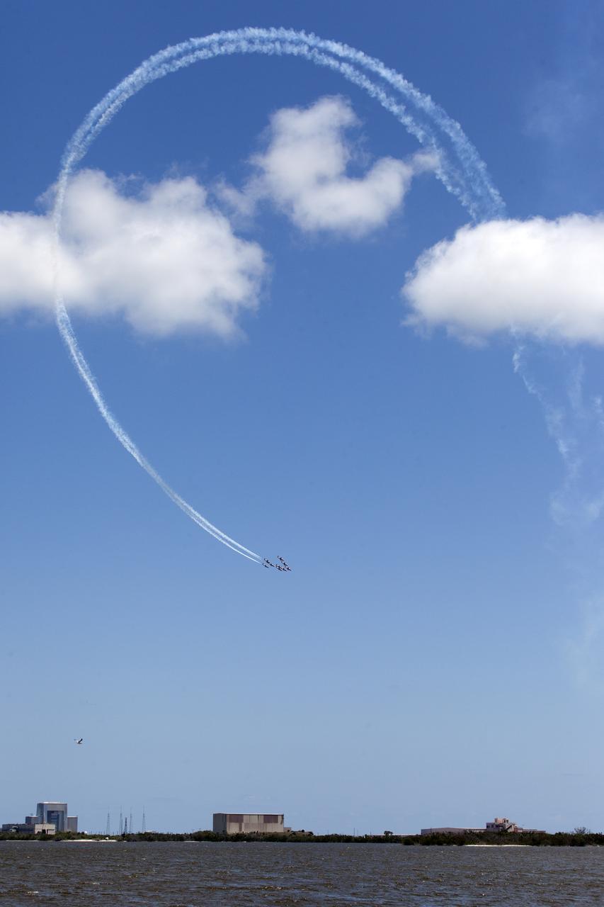 Canadian Forces Snowbirds perform a loop maneuver over Cape Canaveral Air Force Station in Florida during a practice flight between their scheduled U.S. air shows on May 9, 2018.