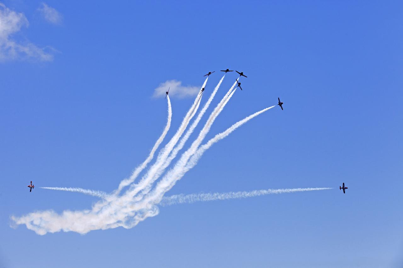 Canadian Forces Snowbirds perform an aerial acrobatic maneuver over NASA's Kennedy Space Center in Florida during a practice flight on May 9, 2018, between their scheduled U.S. air shows.