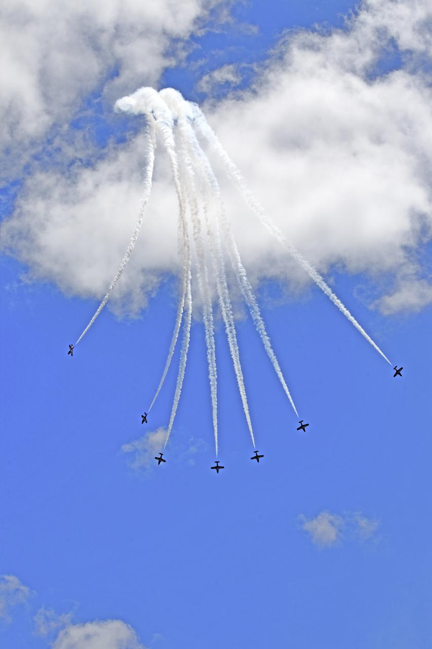 Canadian Forces Snowbirds perform an aerial acrobatic maneuver over NASA's Kennedy Space Center in Florida during a practice flight on May 9, 2018, between their scheduled U.S. air shows.