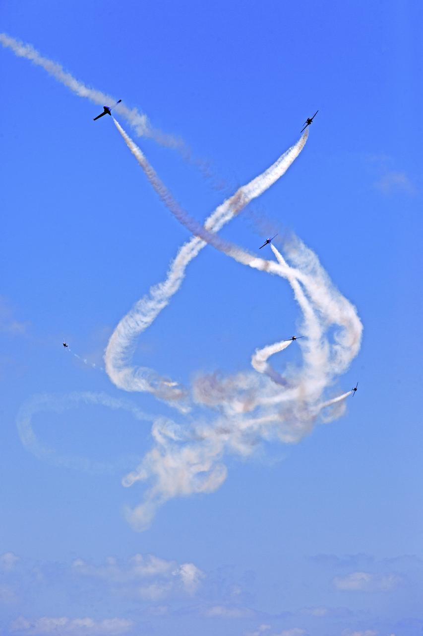 Canadian Forces Snowbirds perform an aerial maneuver over NASA's Kennedy Space Center in Florida during a practice flight on May 9, 2018, between their scheduled U.S. air shows.