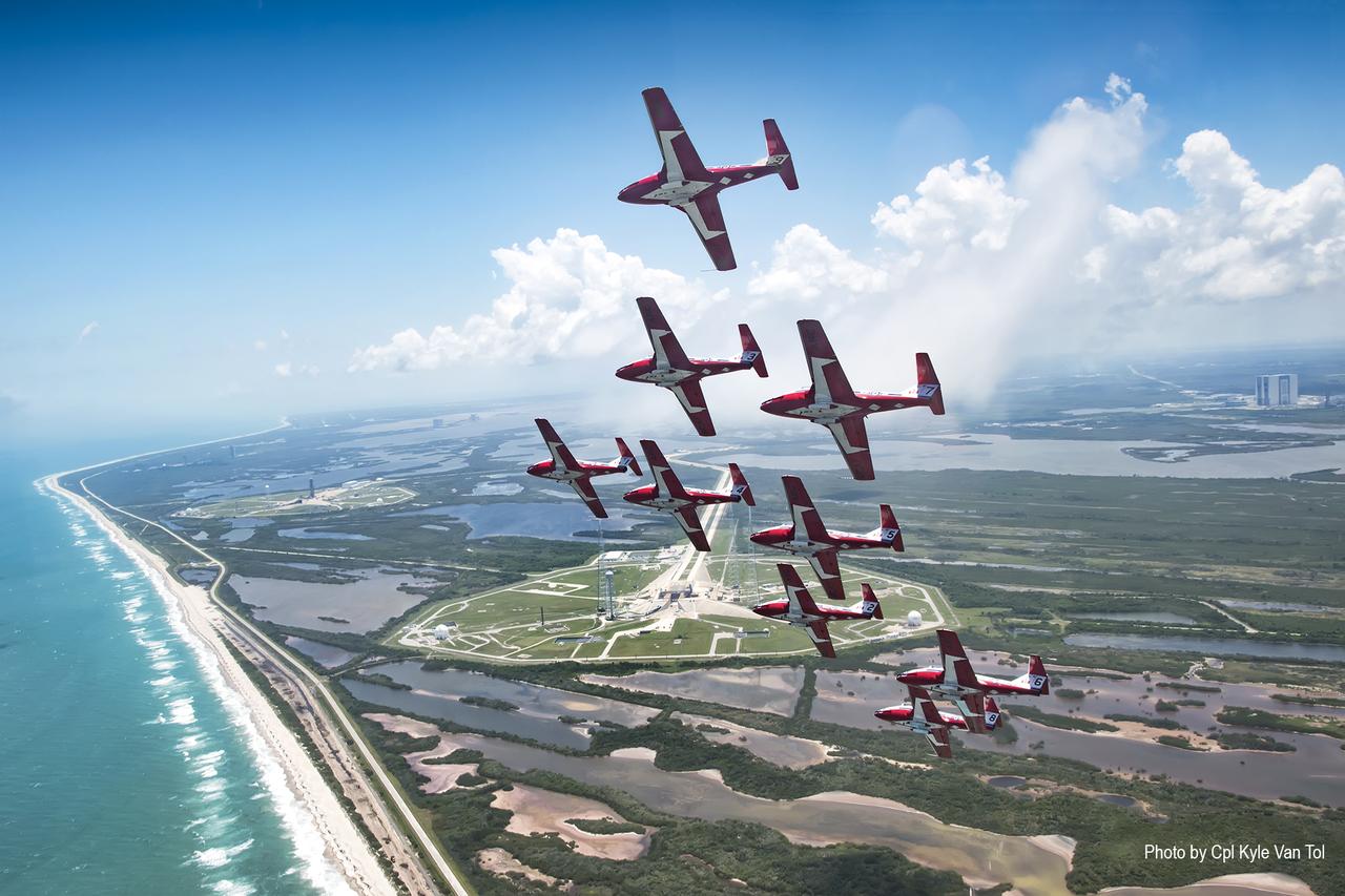 The Canadian Forces Snowbirds fly in Concorde formation over Launch Complex 39B and the Space Coast shoreline at NASA’s Kennedy Space Center in Florida. The Snowbirds, Canada’s air demonstration team, carried out a practice flight over Kennedy and nearby Cape Canaveral Air Force Station in Florida on Wednesday, May 9, 2018, between their scheduled U.S. air shows.