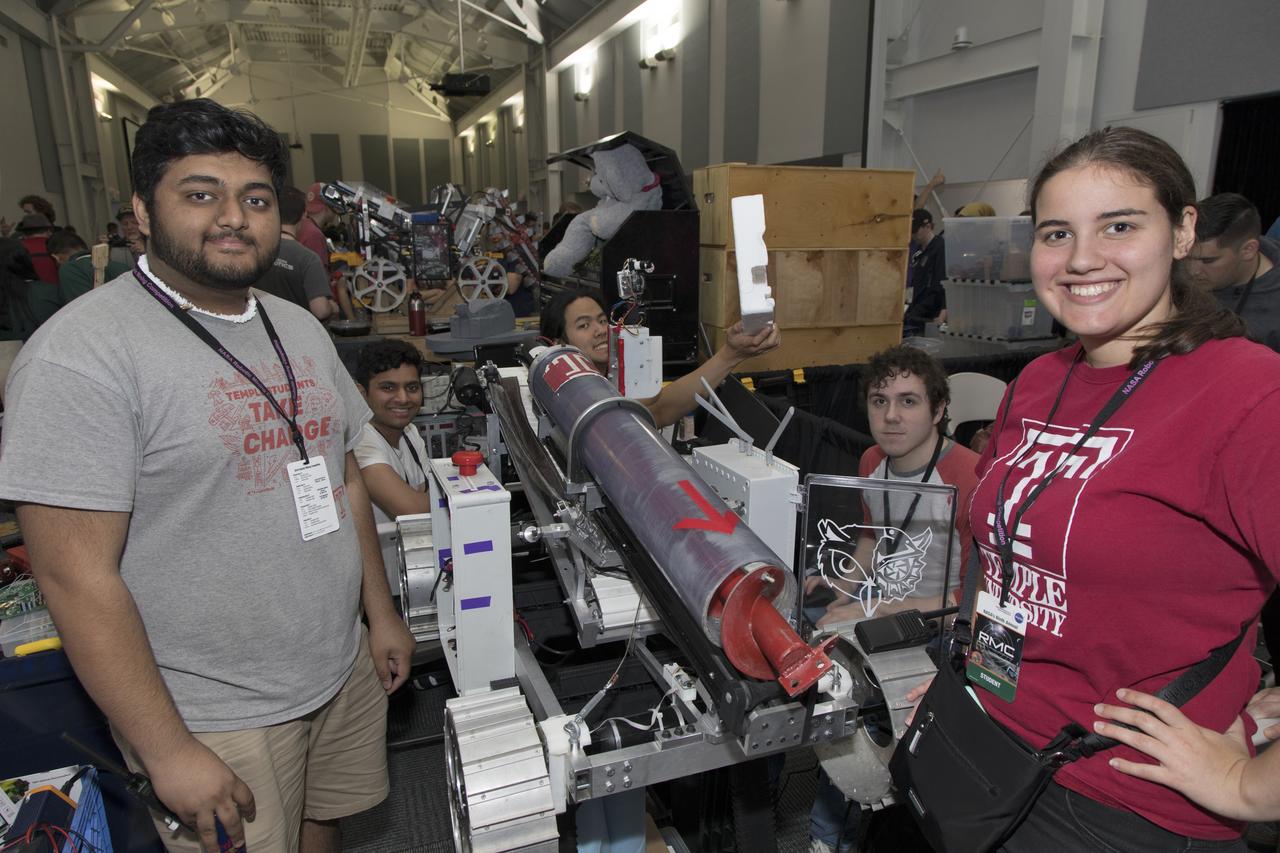 On the second day of NASA's 9th Robotic Mining Competition, May 15, team members from Temple University work on their robot miner in the RobotPits in the Educator Resource Center at Kennedy Space Center Visitor Complex in Florida. More than 40 student teams from colleges and universities around the U.S. will use their mining robots to dig in a supersized sandbox filled with BP-1, or simulated Lunar soil, gravel and rocks, and participate in other competition requirements. The Robotic Mining Competition is a NASA Human Exploration and Operations Mission Directorate project designed to encourage students in science, technology, engineering and math, or STEM fields. The project provides a competitive environment to foster innovative ideas and solutions that could be used on NASA's deep space missions.