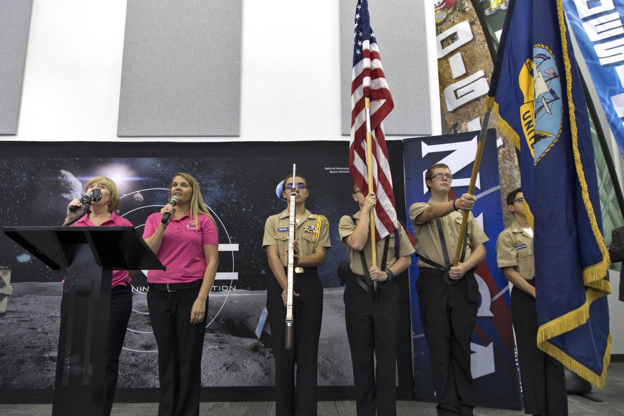 A flag presentation and singing of the National Anthem are part of the opening ceremony of NASA's 9th Robotic Mining Competition, May 15, in the RobotPits in the Educator Resource Center at Kennedy Space Center Visitor Complex in Florida. More than 40 student teams from colleges and universities around the U.S. will use their uniquely designed mining robots to dig in a supersized sandbox filled with BP-1, or simulated Lunar soil, gravel and rocks, and participate in other competition requirements. The Robotic Mining Competition is a NASA Human Exploration and Operations Mission Directorate project designed to encourage students in science, technology, engineering and math, or STEM fields. The project provides a competitive environment to foster innovative ideas and solutions that could be used on NASA's deep space missions.