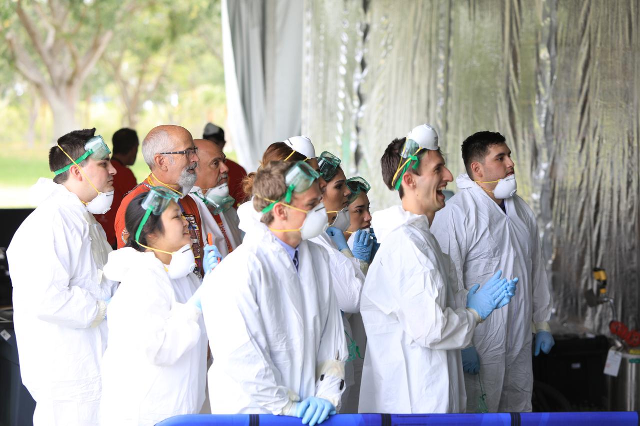 Team members cheer during their robot miner's turn in the mining arena on the third day of NASA's 9th Robotic Mining Competition, May 16, at NASA's Kennedy Space Center Visitor Complex in Florida. More than 40 student teams from colleges and universities around the U.S. will use their mining robots to dig in a supersized sandbox filled with BP-1, or simulated Lunar soil, gravel and rocks, and participate in other competition requirements. The Robotic Mining Competition is a NASA Human Exploration and Operations Mission Directorate project designed to encourage students in science, technology, engineering and math, or STEM fields. The project provides a competitive environment to foster innovative ideas and solutions that could be used on NASA's deep space missions.