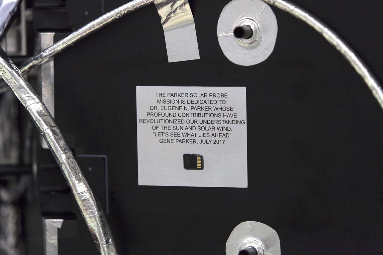 On Friday, May 18, 2018, at the Astrotech processing facility in Titusville, Florida, near NASA's Kennedy Space Center, a computer chip is installed on NASA's Parker Solar Probe. Throughout its seven-year mission, NASA’s Parker Solar Probe will swoop through the Sun’s atmosphere, carrying more than scientific instruments on this historic journey — it will also hold more than 1.1 million names submitted by the public to go to the Sun. The submitted names were loaded into a memory card and mounted on a plaque bearing a dedication to the mission’s namesake, heliophysicist Dr. Eugene Parker. The Parker Solar Probe will launch on a United Launch Alliance Delta IV Heavy rocket from Space Launch Complex 37 at Cape Canaveral Air Force Station in Florida no earlier than Aug. 4, 2018. The mission will perform the closest-ever observations of a star when it travels through the Sun's atmosphere, called the corona. The probe will rely on measurements and imaging to revolutionize our understanding of the corona and the Sun-Earth connection.