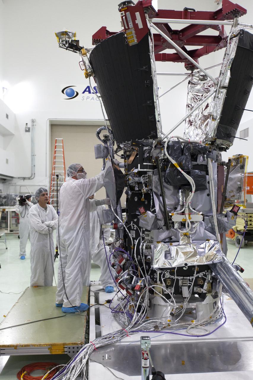 In the Astrotech processing facility in Titusville, Florida, near NASA's Kennedy Space Center, on Wednesday, May 23, 2018, technicians and engineers deploy the magnetometer boom on NASA's Parker Solar Probe. The Parker Solar Probe will launch on a United Launch Alliance Delta IV Heavy rocket from Space Launch Complex 37 at Cape Canaveral Air Force Station in Florida no earlier than Aug. 4, 2018. The mission will perform the closest-ever observations of a star when it travels through the Sun's atmosphere, called the corona. The probe will rely on measurements and imaging to revolutionize our understanding of the corona and the Sun-Earth connection.