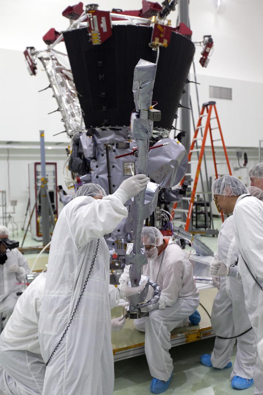 In the Astrotech processing facility in Titusville, Florida, near NASA's Kennedy Space Center, on Wednesday, May 23, 2018, technicians and engineers deploy the magnetometer boom on NASA's Parker Solar Probe. The Parker Solar Probe will launch on a United Launch Alliance Delta IV Heavy rocket from Space Launch Complex 37 at Cape Canaveral Air Force Station in Florida no earlier than Aug. 4, 2018. The mission will perform the closest-ever observations of a star when it travels through the Sun's atmosphere, called the corona. The probe will rely on measurements and imaging to revolutionize our understanding of the corona and the Sun-Earth connection.