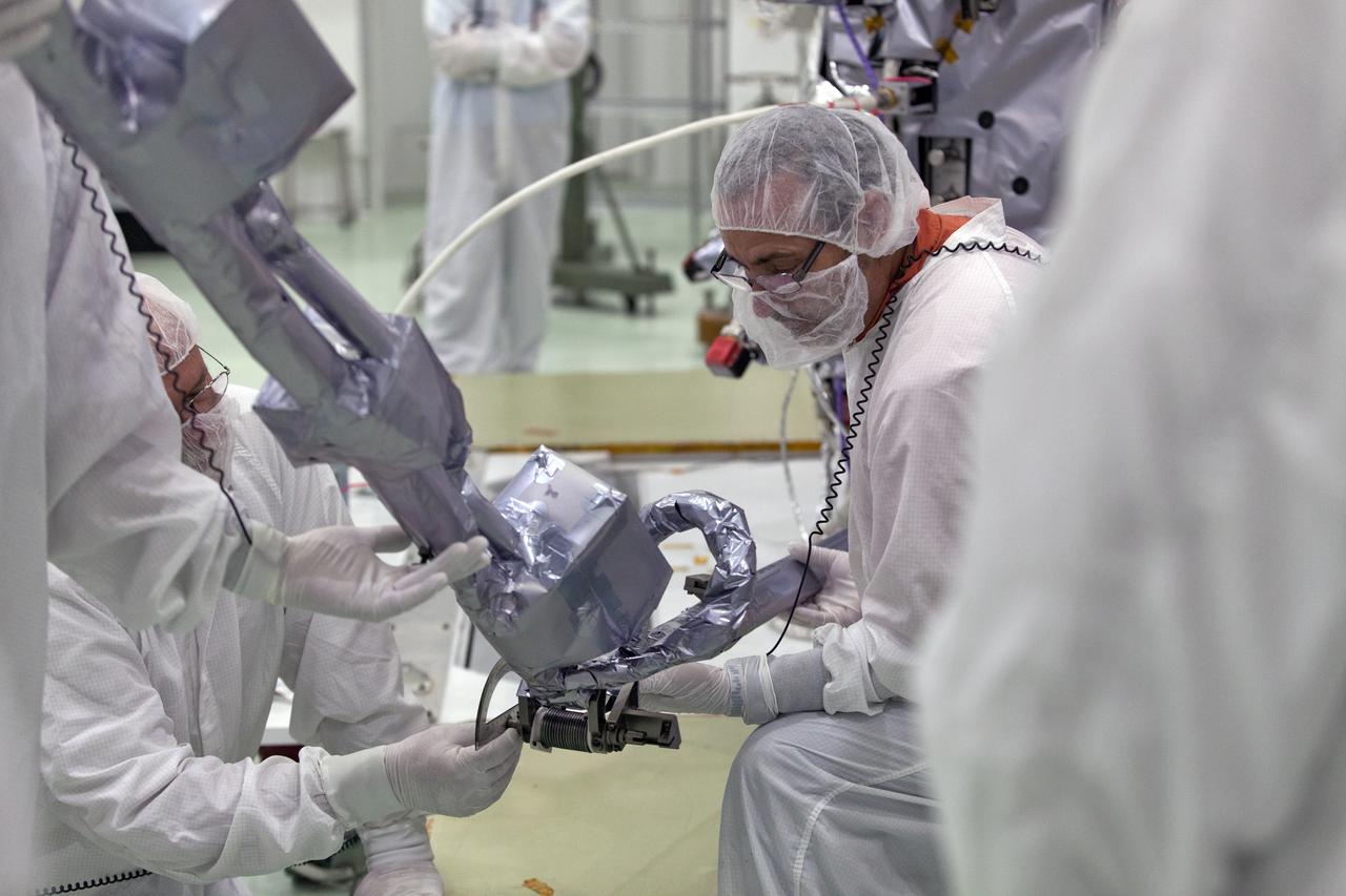 In the Astrotech processing facility in Titusville, Florida, near NASA's Kennedy Space Center, on Wednesday, May 23, 2018, technicians and engineers deploy the magnetometer boom on NASA's Parker Solar Probe. The Parker Solar Probe will launch on a United Launch Alliance Delta IV Heavy rocket from Space Launch Complex 37 at Cape Canaveral Air Force Station in Florida no earlier than Aug. 4, 2018. The mission will perform the closest-ever observations of a star when it travels through the Sun's atmosphere, called the corona. The probe will rely on measurements and imaging to revolutionize our understanding of the corona and the Sun-Earth connection.