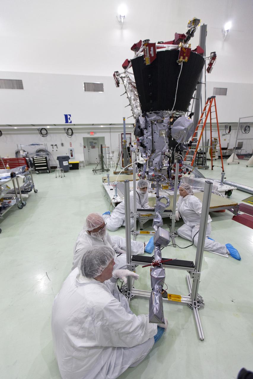 In the Astrotech processing facility in Titusville, Florida, near NASA's Kennedy Space Center, on Wednesday, May 23, 2018, technicians and engineers deploy the magnetometer boom on NASA's Parker Solar Probe. The Parker Solar Probe will launch on a United Launch Alliance Delta IV Heavy rocket from Space Launch Complex 37 at Cape Canaveral Air Force Station in Florida no earlier than Aug. 4, 2018. The mission will perform the closest-ever observations of a star when it travels through the Sun's atmosphere, called the corona. The probe will rely on measurements and imaging to revolutionize our understanding of the corona and the Sun-Earth connection.