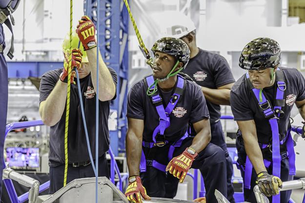 The Boeing extrication team train on the Boeing Mock-up Trainer from May 25 through May 28, 2018, at NASA's Johnson Space Center in Houston. The extrication team is comprised of firefighters from various U.S. Boeing sites. Each member of the team brings an expertise in Aerospace Confined Space Rescue, are Emergency Medical Technicians and have years of rescue experience. The team is highly motivated to getting the crew out quickly, safely and efficiently. The training at Johnson included suit training, side hatch egress, and Intravehicular Activity (IVA) rigging and egress. The week included a run for record on IVA egress for a testing requirement. Participants also included NASA Medical, the 45th Operations Group's Detachment 3, based at Patrick Air Force Base, and U.S. Air Force pararescue representation.