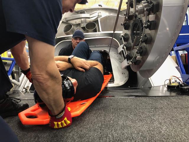 NASA image: Boeing Extrication Team training on Boeing Mock-Up Trainer (BMT)