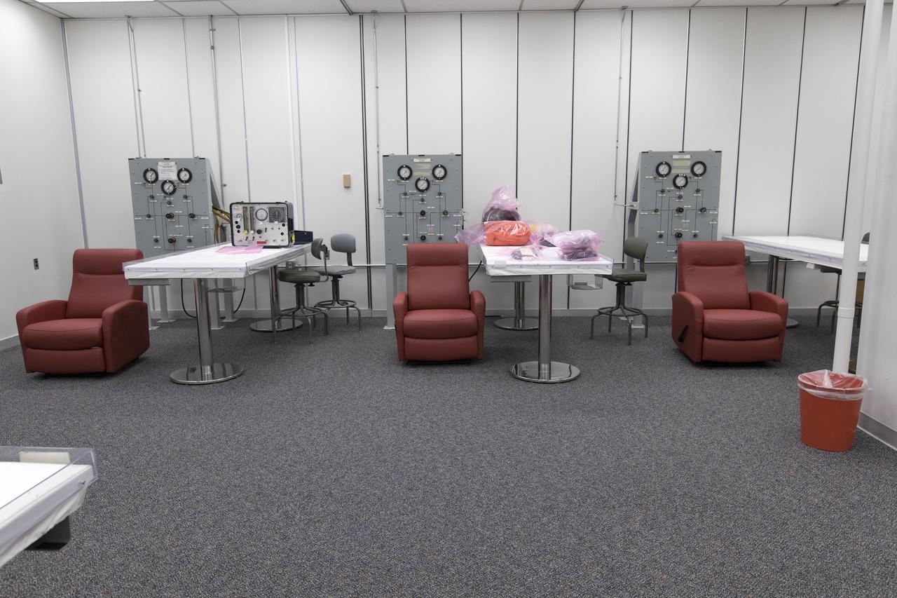 New carpeting, ceiling tiles, appliances and fresh paint are among the improvements that have been made to the astronaut crew quarters, located in the Neil Armstrong Operations and Checkout Building at Kennedy Space Center in Florida. Shown here is the suit room, where astronauts are helped into their pressure suits before leaving the crew quarters for a mission. This room now features three suit containment rooms — one each for Orion, Boeing and SpaceX.