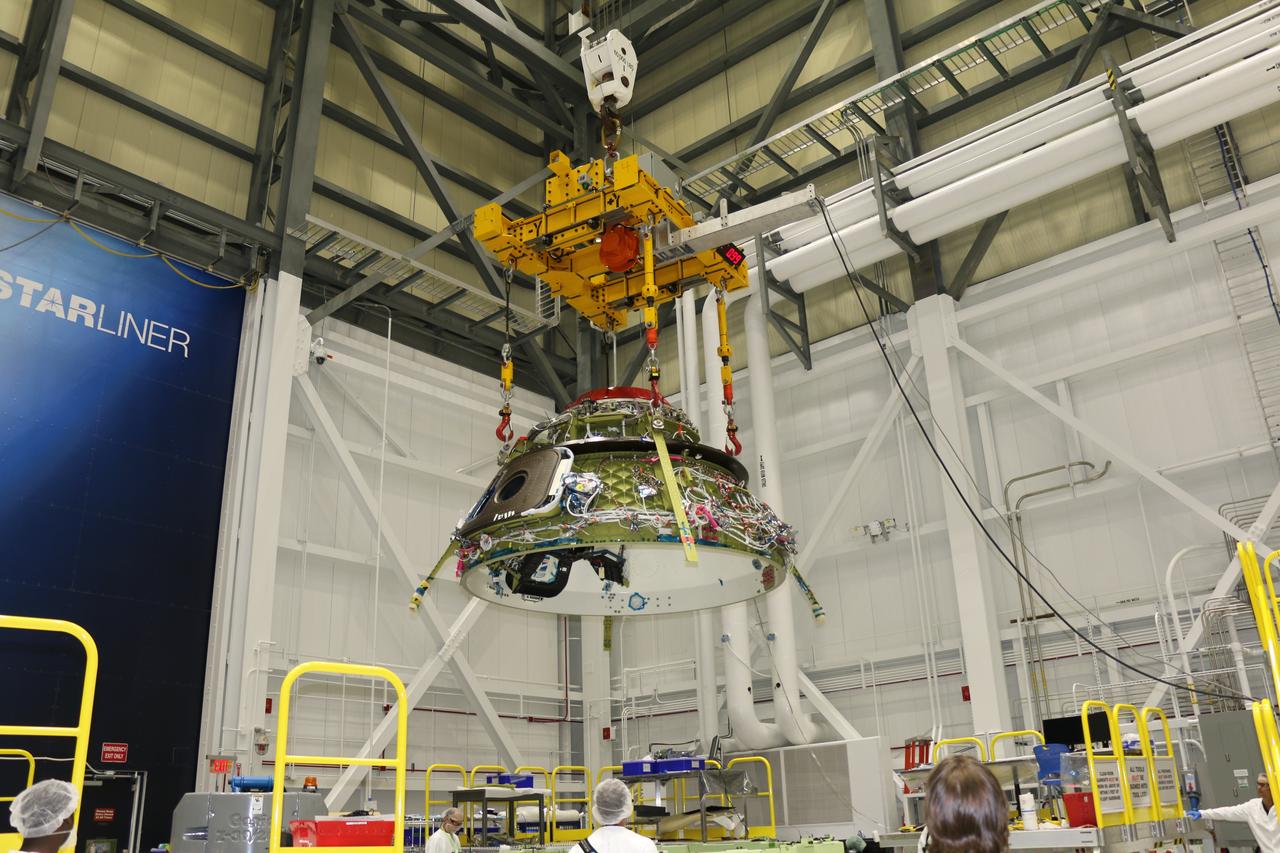 The upper and lower domes of the Boeing CST-100 Starliner Spacecraft 2 Crew Flight Test Vehicle were mated June 19, 2018, inside the Commercial Crew and Cargo Processing Facility (C3PF) at Kennedy Space Center in Florida. The Starliner will launch astronauts on a United Launch Alliance Atlas V rocket to the International Space Station as part of NASA’s Commercial Crew Program.